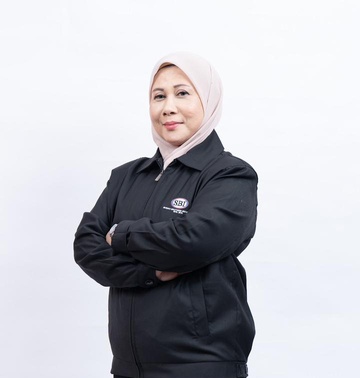Datin Nazila Yusof, Executive Director, arms folded, in a black SBI jacket.