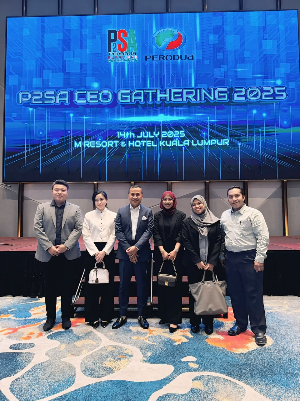 Six members of SBI's team in front of a screen reading P2SA CEO Gathering 2025, 14th July 2025, M Resort & Hotel Kuala Lumpur, with the P2SA and Perodua logos.