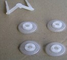 Four translucent white shipping plugs and a white runner.